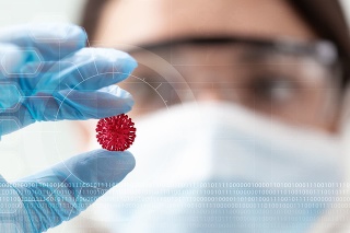 woman scientist holding a coronavirus in a research lab