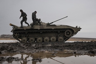 Ukrainian soldiers are walking on an armored combat vehicle during an exercise in the controlled area of ​​the Joint Forces operation in the Donetsk region in eastern Ukraine, Thursday, February 10, 2022.