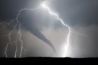 A powerful thunderstorm producing a tornado and lightning.