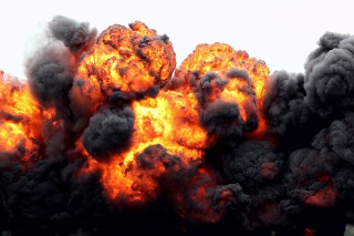 A large billowing fireball from a gasoline explosion.