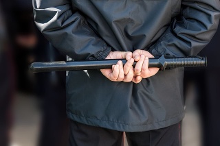 Russian policeman with police truncheon. Text in russian: Police