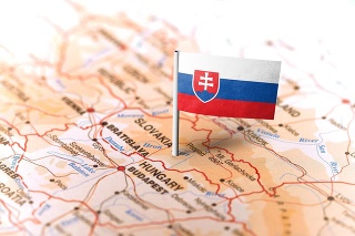 The flag of Slovakia pinned on the map. Horizontal orientation. Macro photography.
