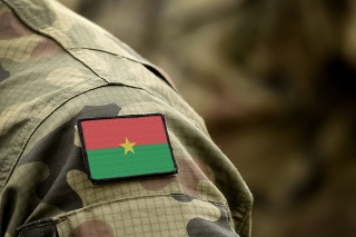 Flag of Burkina Faso on military uniform. Army, troops, soldiers, Africa, (collage).