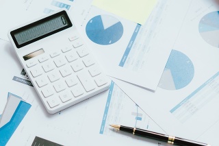 Business graph, sales report, calculator, pen ,Financial and Accounting concept.