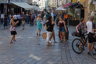 Bratislava, Slovakia, august 15th 2018, crowded main street in the old town of Bratislava on a sunny summer day, people dressed in casual summer clothing are walking, shopping, standing or sitting at a restaurant - Bratislava is the capital city and has a population of 475.000 (2022)
