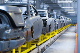 Modern automobile production line, automated production equipment. Shop for the Assembly of new modern cars. The way of Assembly of the car on the Assembly line at the plant
