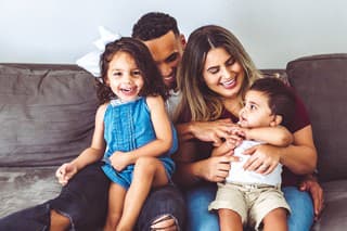 Cute family in their living room, at home portrait