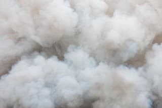 Close up swirling white smoke background,Billowing Black Smoke from ignition midden.