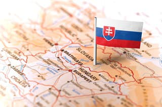 The flag of Slovakia pinned on the map. Horizontal orientation. Macro photography.