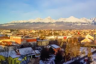 Mountains over colorful buildings and houses at Poprad, Slovakia. Morning
