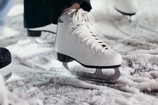 People Wearing White Ice Skating Shoes
