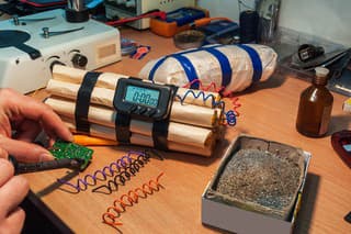 explosives (timebomb) maker in workshop