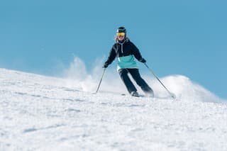 Pas de la Casa, Andorra: January 3, 2022: Woman skiing in the Pyrenees at the Grandvalira ski resort in Andorra in Covid19 time