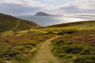 Bardsey Island from the hills above Aberdaron on the Llŷn Peninsula, North Wales. Bardsey Island was in medieval times a major centre of pilgrimage.