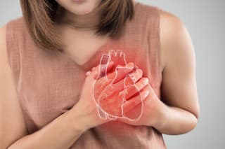 The photo of heart is on the woman's body, Severe heartache, Having heart attack or Painful cramps, Heart disease, Pressing on chest with painful expression.