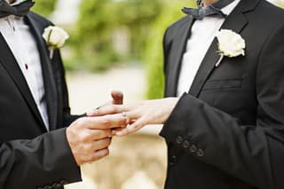 Gay Couple Exchanging Rings at Wedding