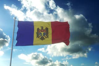 Flag of Moldova waving at wind against beautiful blue sky. 3d rendering.