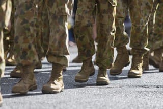 Feet of soldiers marching at an ANZAC Day parade on the streets of a regional country town