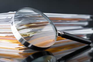 File Stack and Magnifying Glass
