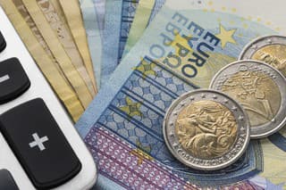 Close up of a calculator and euro money in a financial analyzing concept