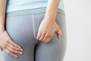 Women with ass pain caused by hemorrhoids