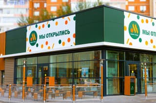 Krasnoyarsk, Russia - August 8, 2022: Restaurant of the new Russian brand Vkusno i Tochka. The facade of the building is decorated with a banner with the logo. Former McDonald's restaurant