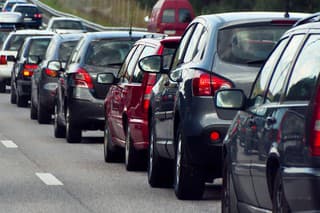 Typical scene during rush hour. A traffic jam with rows of cars.  Shallow depth of field.