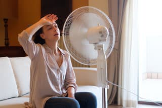 Woman feeling hot and trying to refresh in summertime heat