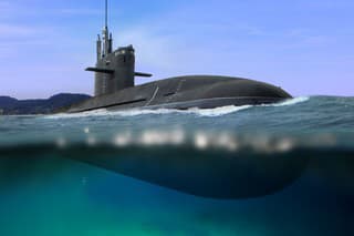 Naval submarine floating and half submerged in shallow water
