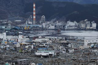 A View of debris and mud covered at Tsunami hit Destroyed Industrial Area in Ofunato on March 23, 2011, Japan.  On 11 March 2011, an earthquake hit Japan with a magnitude of 9.0, the biggest in the nation's recorded history and one of the five most powerful recorded ever around the world. Within an hour of the earthquake, towns which lined the shore were flattened by a massive tsunami, caused by the energy released by the earthquake. With waves of up to four or five metres high, they crashed through civilians homes, towns and fields.