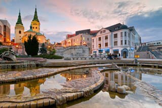 Zilina, Slovakia - June 03, 2016: Image shows the square of Andrej Hlinka in the city of Zilina in central Slovakia. Cathedral and theater can be seen in the image as well. There are few people walking in the square.