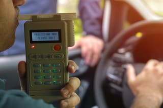 Driver due to being subject to test for alcohol content with use of breathalyzer