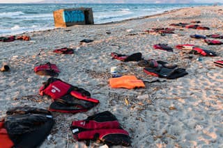 Kos island, Greece - October 6, 2015: Abandoned life savers of refugees on a beach of the island