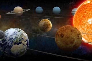 The sun and nine planets of our system orbiting.