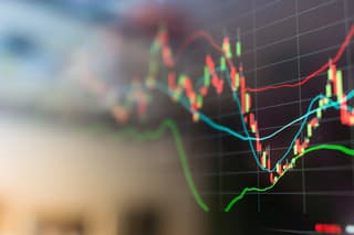 Investment theme stockmarket and finance business analysis stockmarket with digital tablet