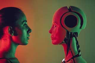 Robot and young woman face to face.