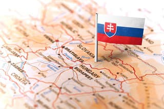 The flag of Slovakia pinned on the map. Horizontal orientation. Macro photography.