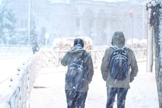 Eskisehir / Turkey-January 06, 2020; Silhouette of the students returning from school, as education was interrupted due to unfavorable weather conditions. snow break. Schools holidays due to snowfall.