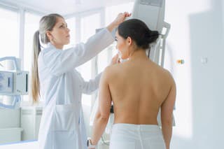 In the Hospital, Female Patients Undergoes Mammogram Screening Procedure Done by Mammography Technologist. Modern Technologically Advanced Clinic with Professional Doctors. Breast Cancer Prevention Screening.
