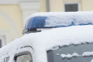 Blue light signal on a police car in winter, visual emergency signal