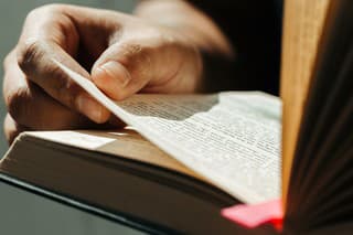 Close up of young man hands hold and reading holy bible.Christian faith concept