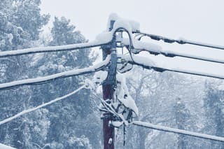 The telegraph pole in a snow day.