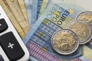Close up of a calculator and euro money in a financial analyzing concept