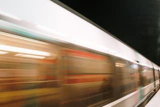 Subway train in motion in a station