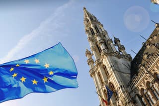 The townhall of Brussels and a flag of European Union