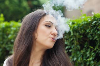 Young woman experiencing smoking negative effects