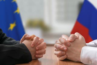 Negotiation of Russia and European Union. Statesman or politicians with clasped hands.