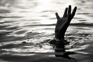 Black and white of Drowning victims, Hand of drowning man needing help. Failure and rescue concept.