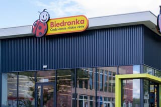 Sosnowiec, Poland 09,30,2022 Biedronka shop signboard ladybug on blue sky background