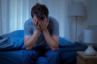 Depressed man at night feeling alone and useless